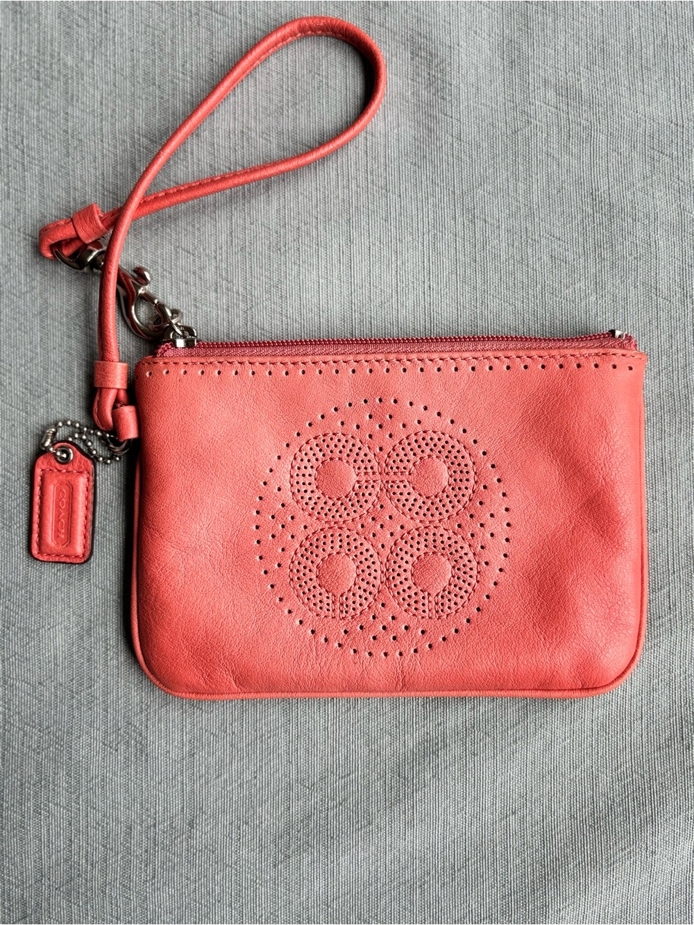 Coach Coral Pink Leather Wristlet with Perforated Logo